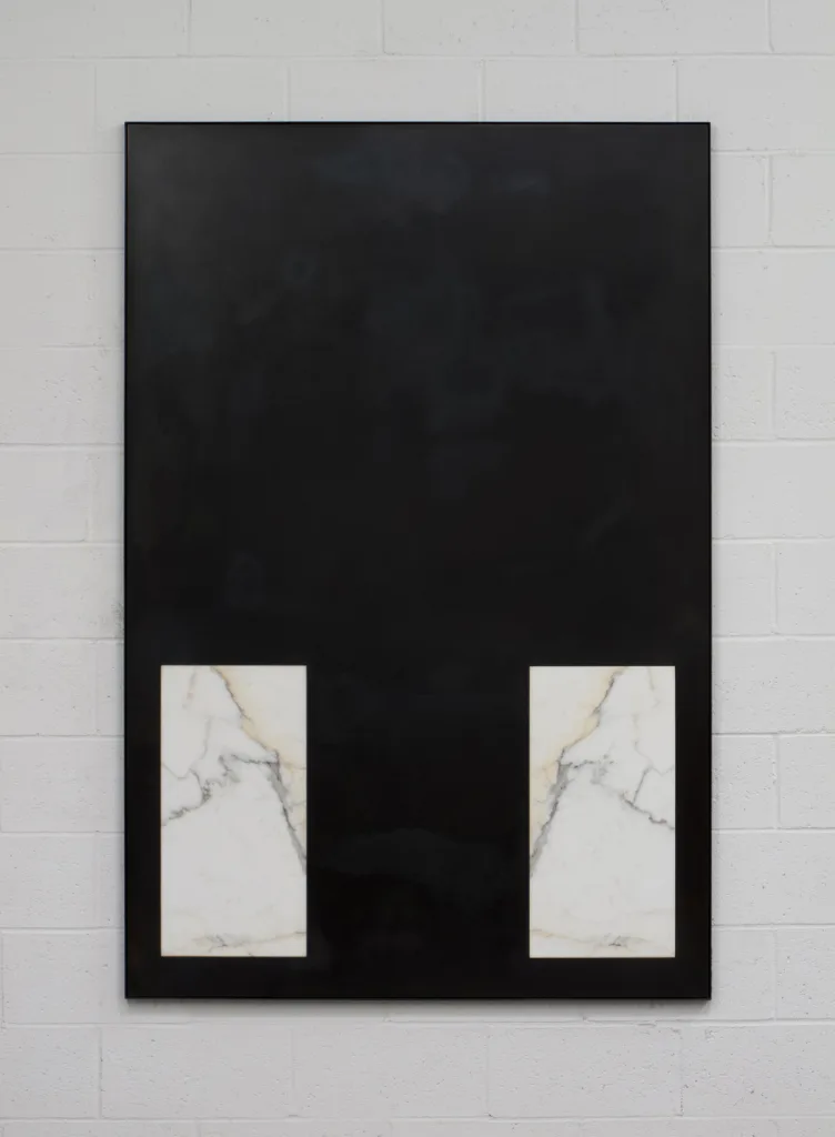 A small panel black steel plates that has carrara marble on both lower part of panel