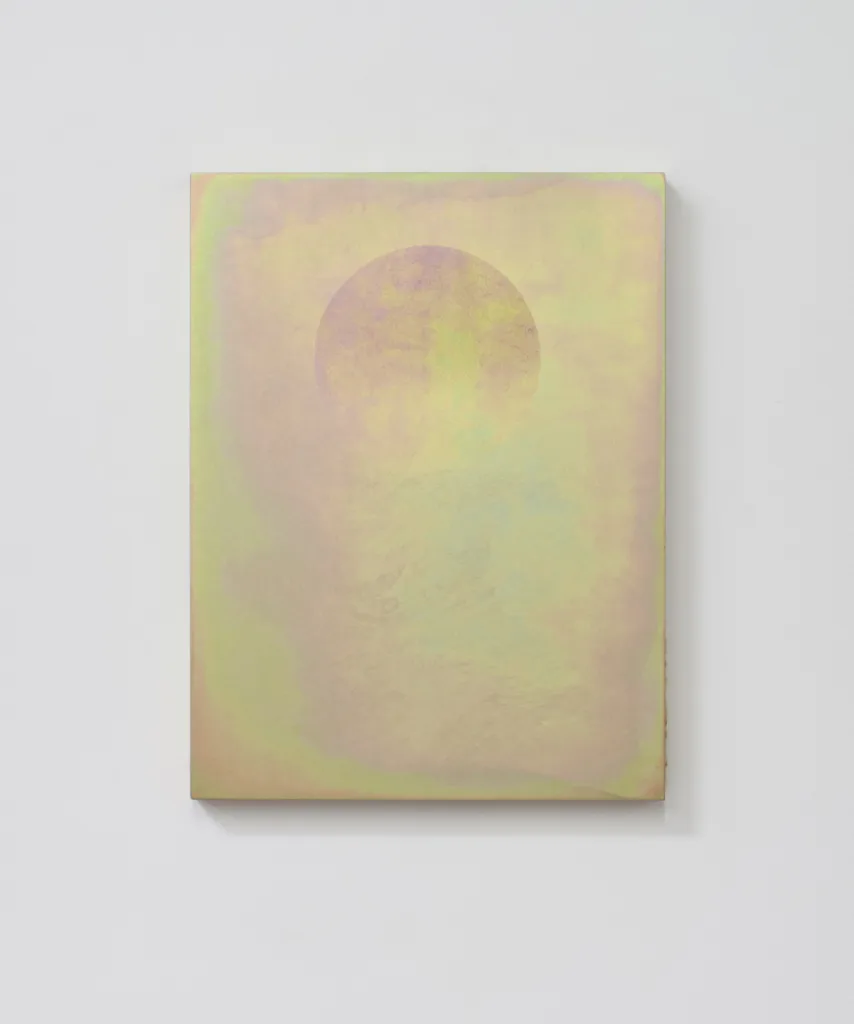A small panel sandblasted aluminum piece that represents a perfect floating circle becomes reminiscent of the moon