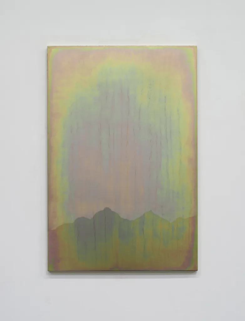 A small panel steel plate piece that represents represents a mountain range and sky