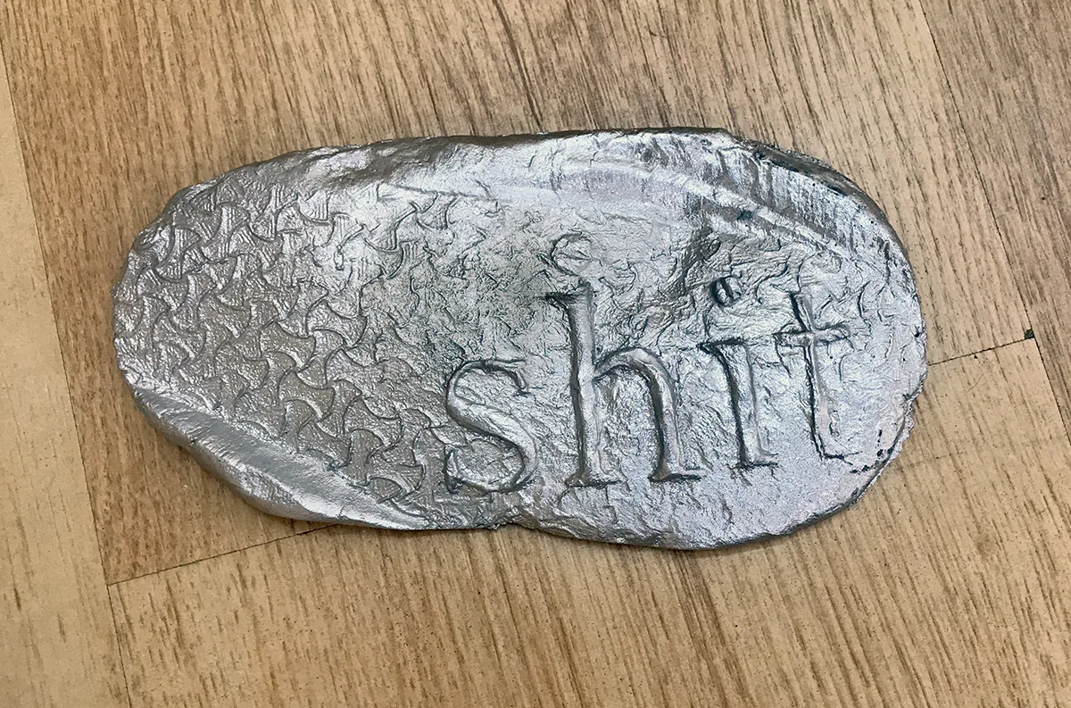 Shit 5 by Tanya Brodsky, Cast aluminum, 6 ½ x 3 ½ x ½ inches