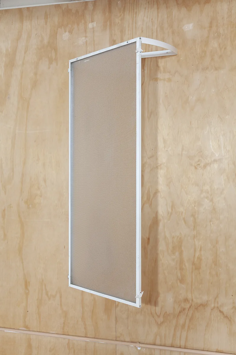 The discreet charm of the ostrich syndrome 3 by Tanya Brodsky, Powder coated steel, salvaged fluorescent light cover, 22 ½ x 46 ½ x 12 inches