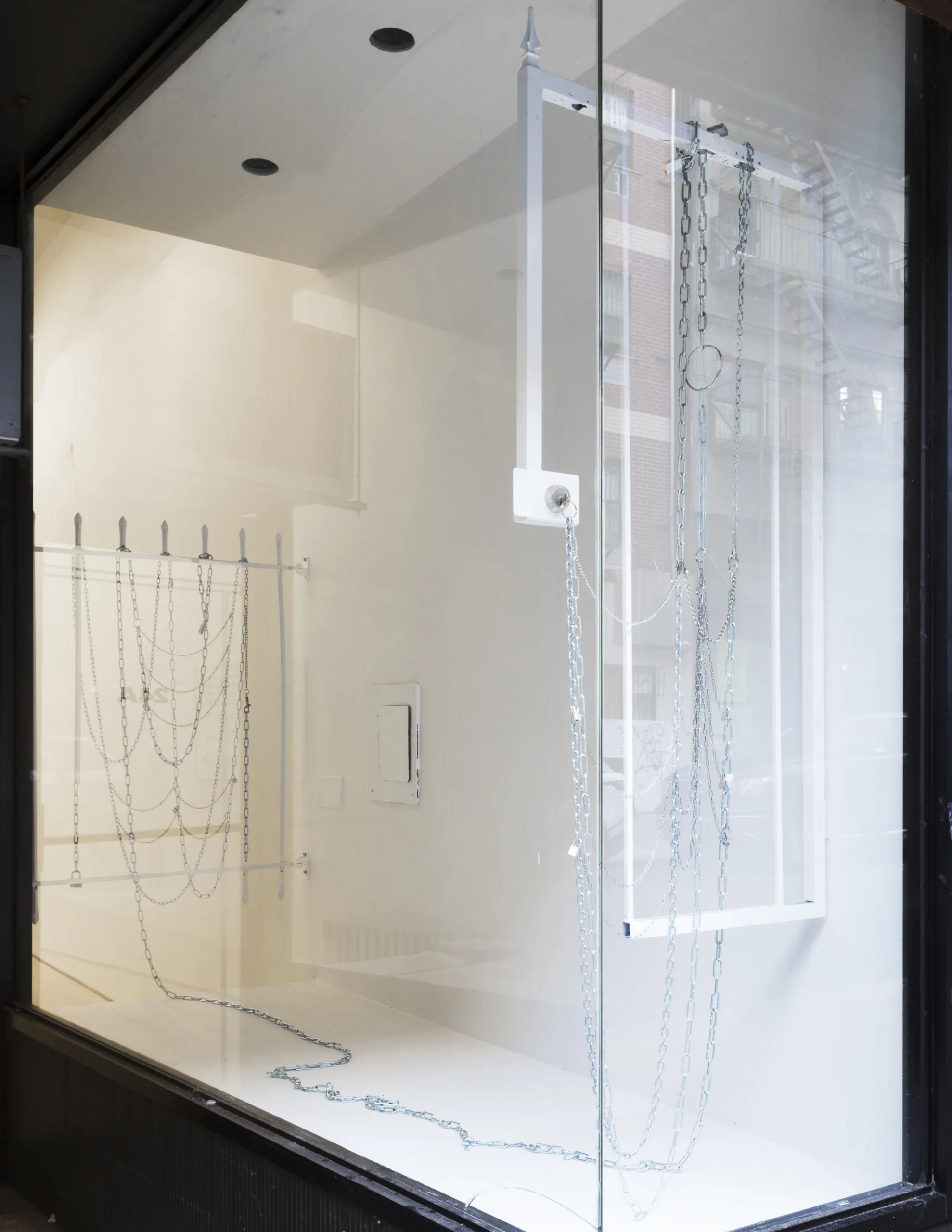 Various Insecurities 1 & 2 by Tanya Brodsky, found gate, found window security bars (modified, powder coated), chain, locks, key rings