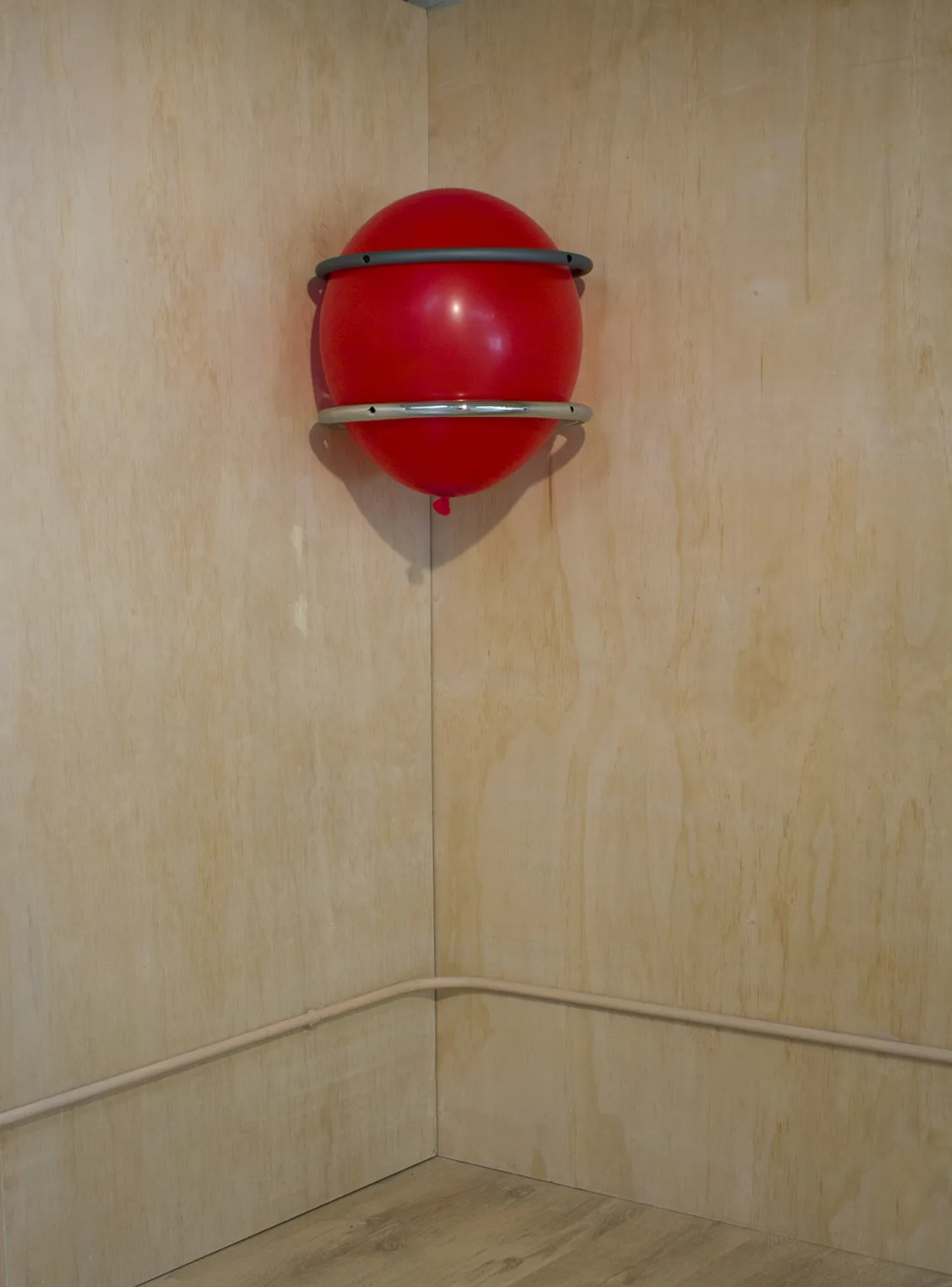 More Fucking Hoops, 2017 by Tanya Brodsky, Found footrests, sandblasted, coated, chromed; balloon 57.5 x 16 x 16 inches