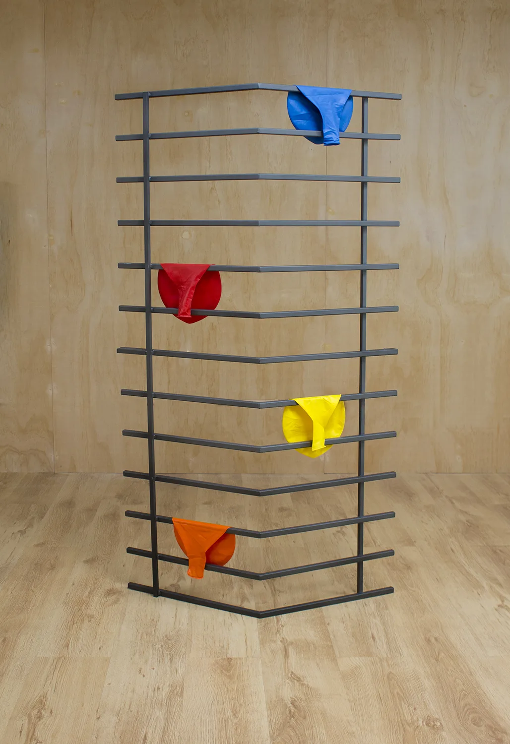 Party City, 2017 by Tanya Brodsky, Found window security bars (modified), sandblasted, coated; balloons 58.5 x 31.5 x 11 inches