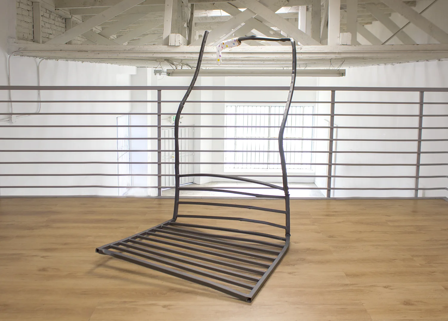 Roommate, 2017 by Tanya Brodsky, Found rolling gate (modified), sandblasted, coated; sock 63 x 38 x 75 inches