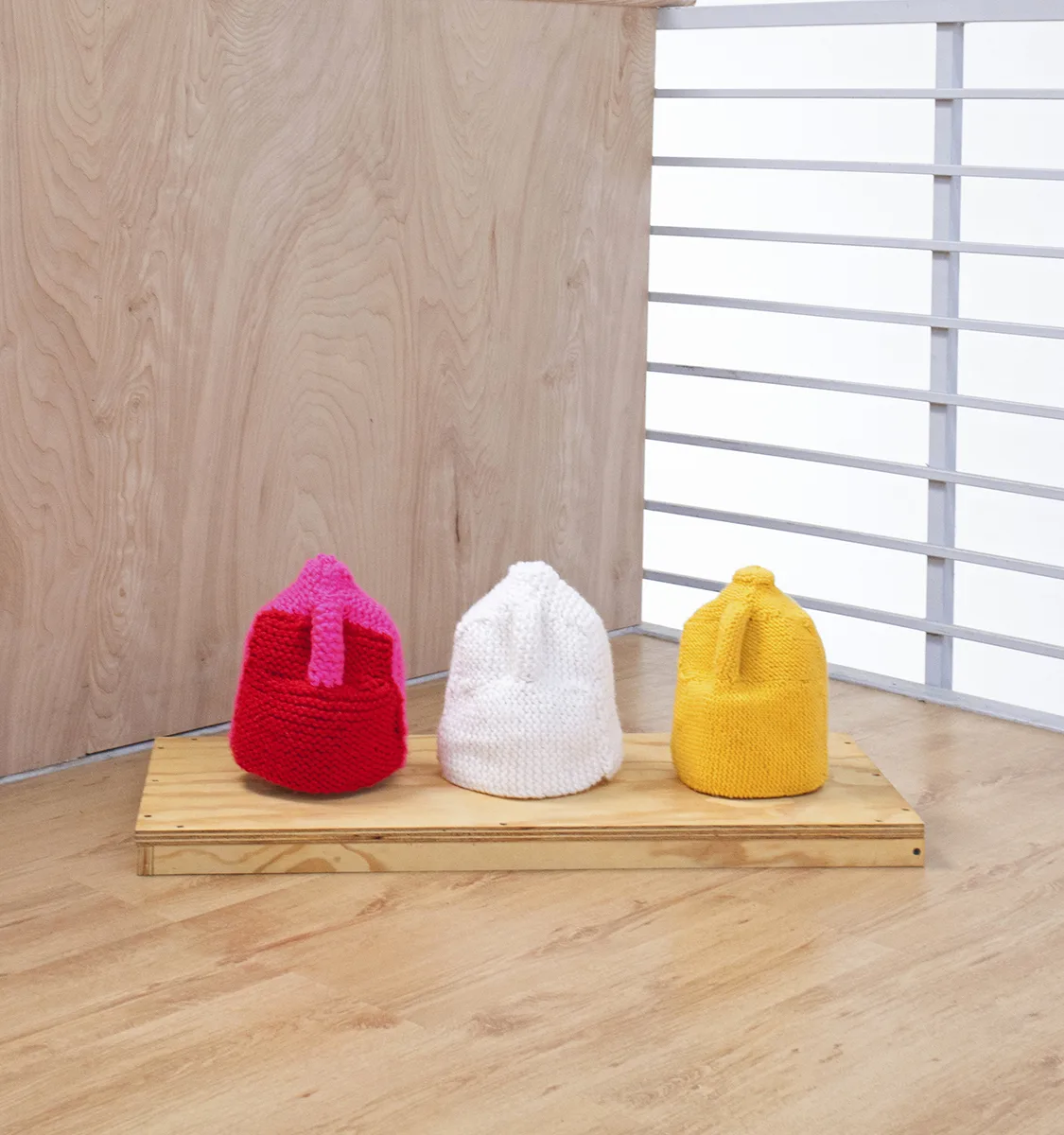 Protection Sweaters by Areli Arellano, Yarn and water gallons 10 x 6 x 6 in