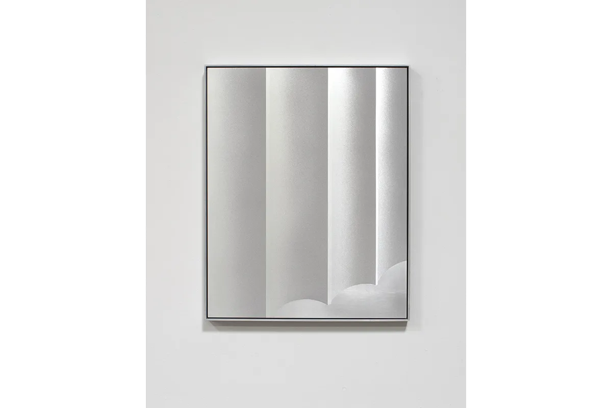 A small panel sandblasted aluminum piece that represents a columns