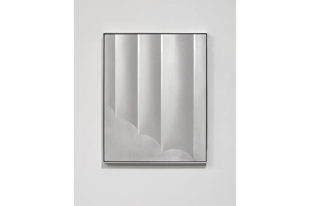 A small panel sandblasted aluminum piece that represents a columns