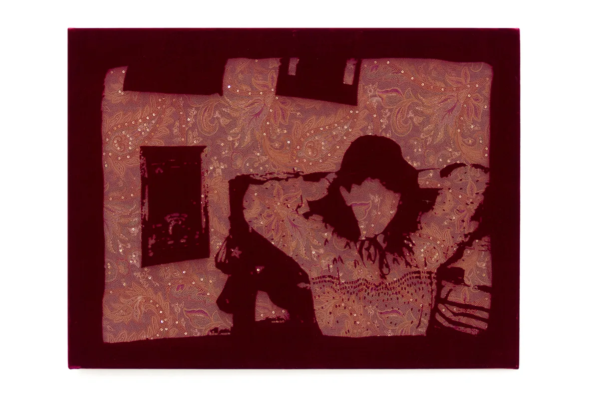 Woman is laying on a bed