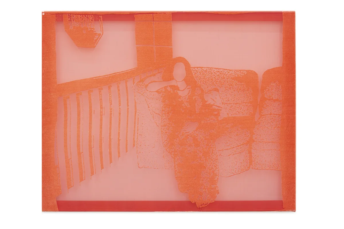 A lady is sitting on a lounge chair