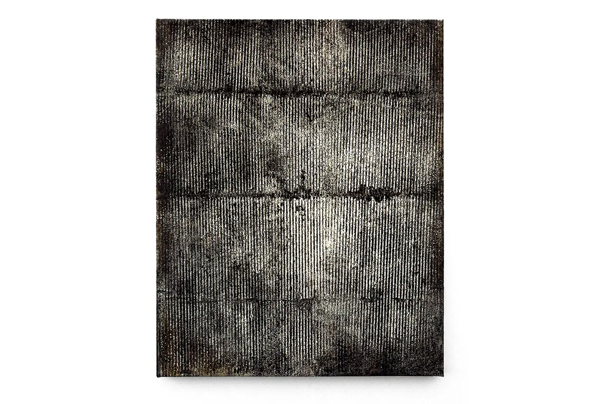 A photo of an earth-toned palates that is mostly black-and-white, mixed-media, abstract artwork