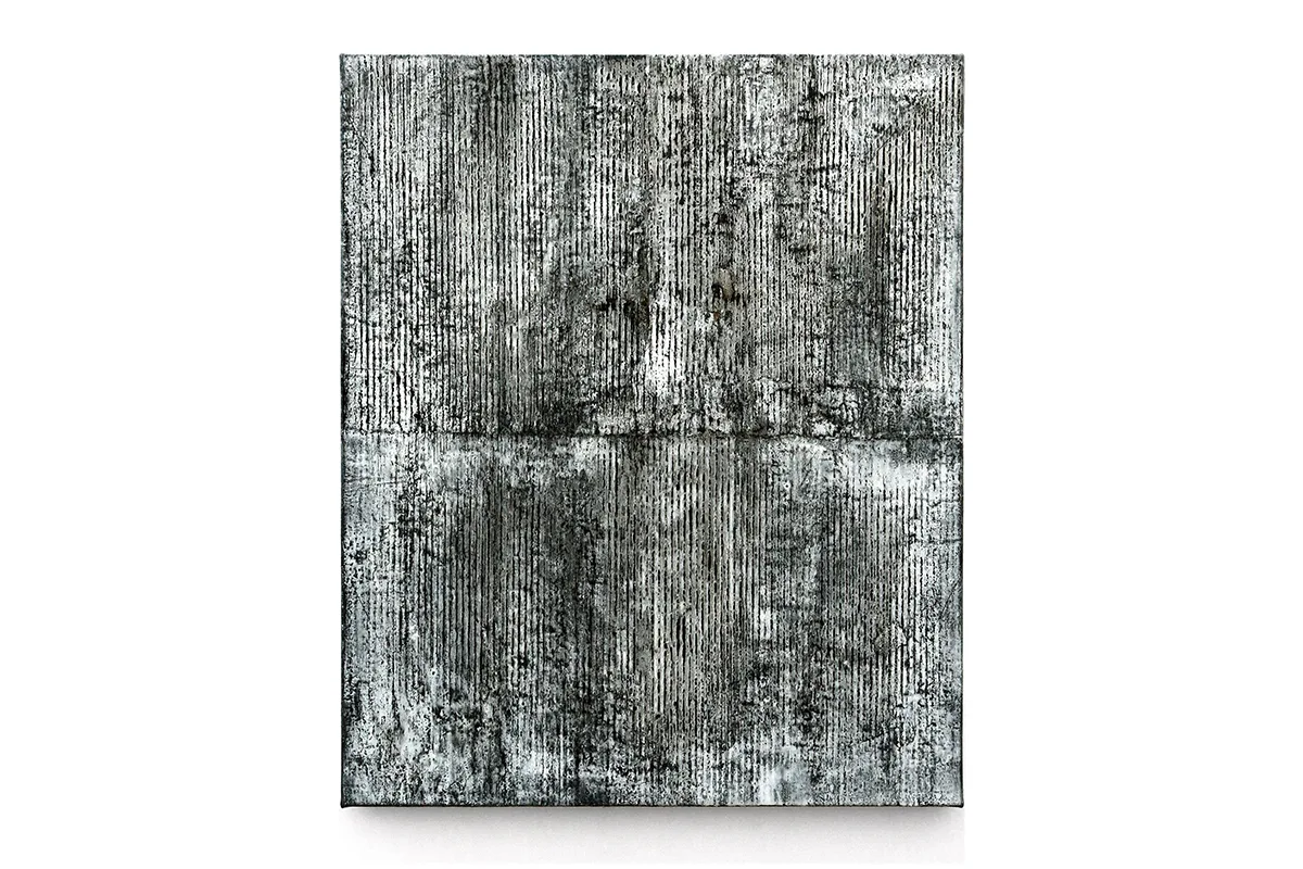 A photo of an earth-toned palates that is mostly black-and-white, mixed-media, abstract artwork