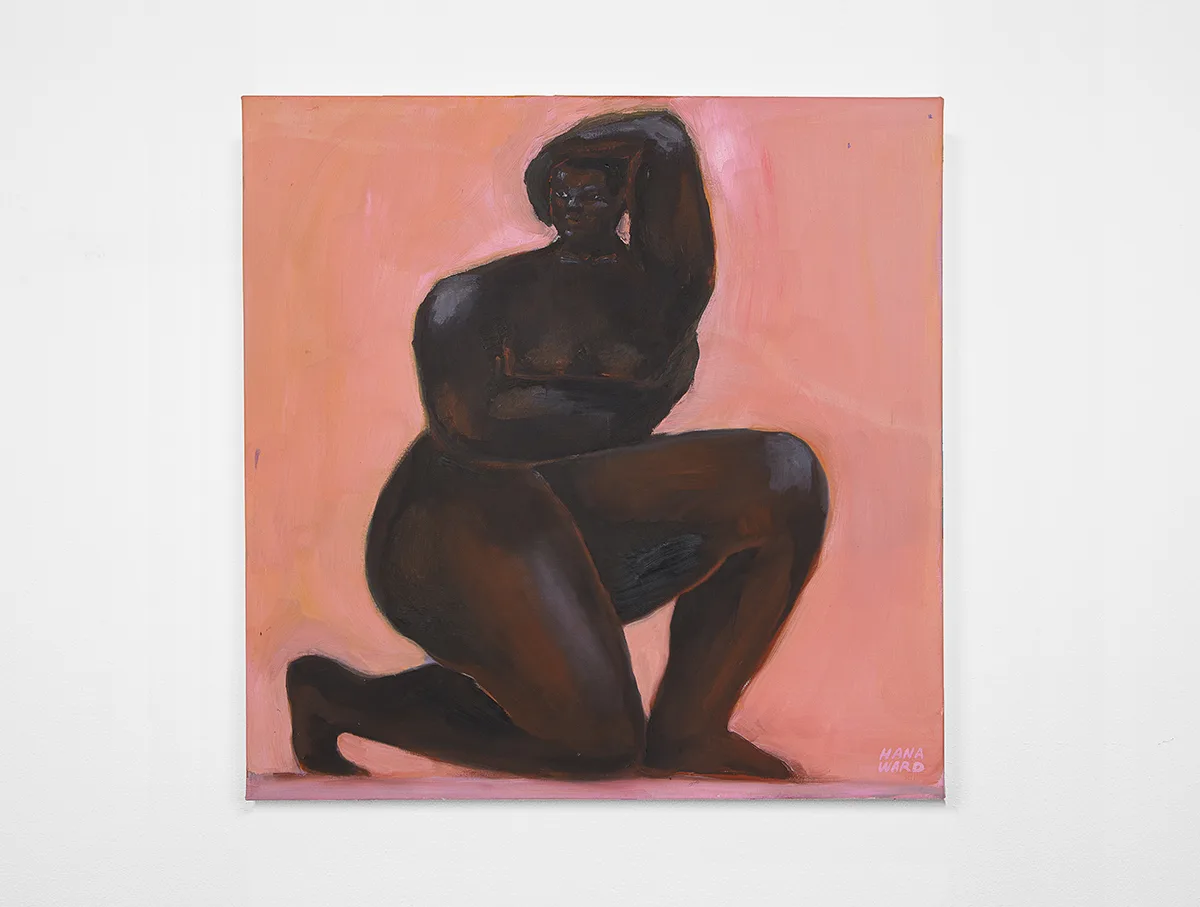 A dark-skinned woman is on her right knee