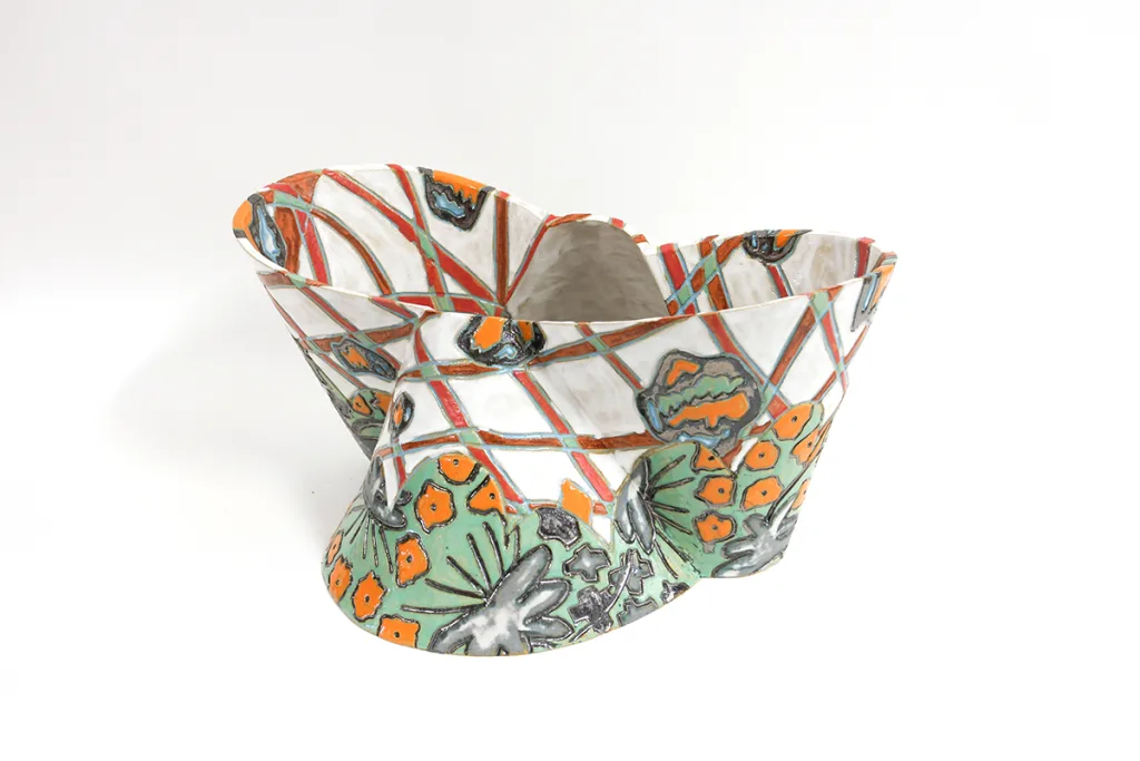 A white ceramic with different symbols on it