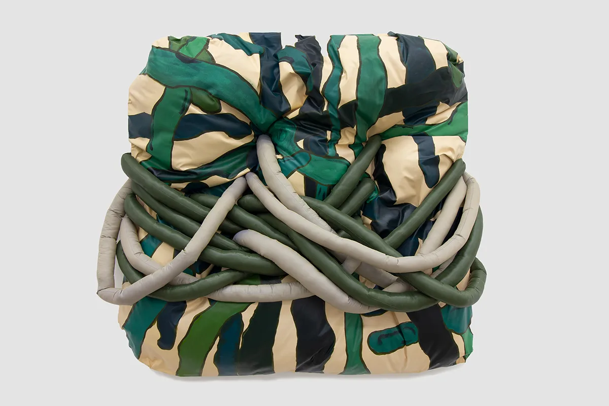 A wall installation that uses a stuffing on the panel technique.