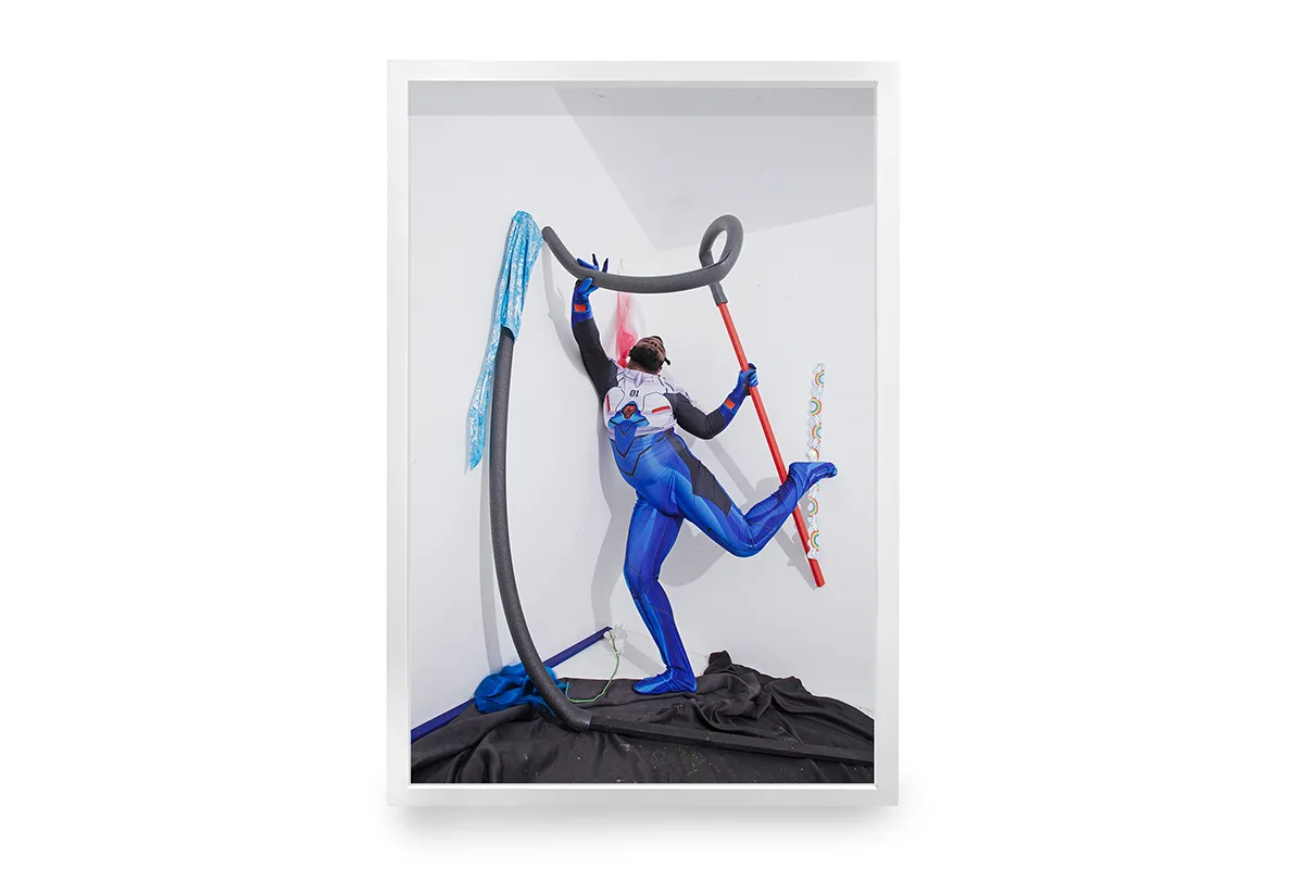 A dark skinned man is wearing a polyester superhero costume