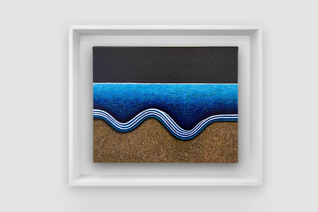 A figurative painting featuring a dark blue ocean and the waves touching the brown shore