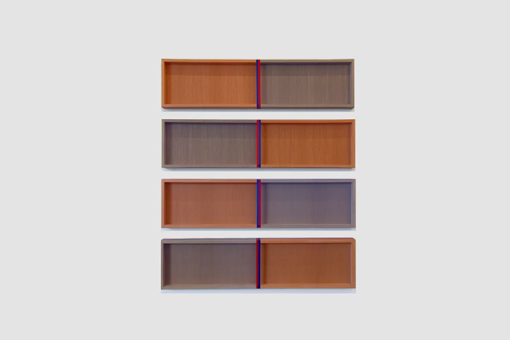 A wall installation that consists of four panels that are painted of earth tone colors