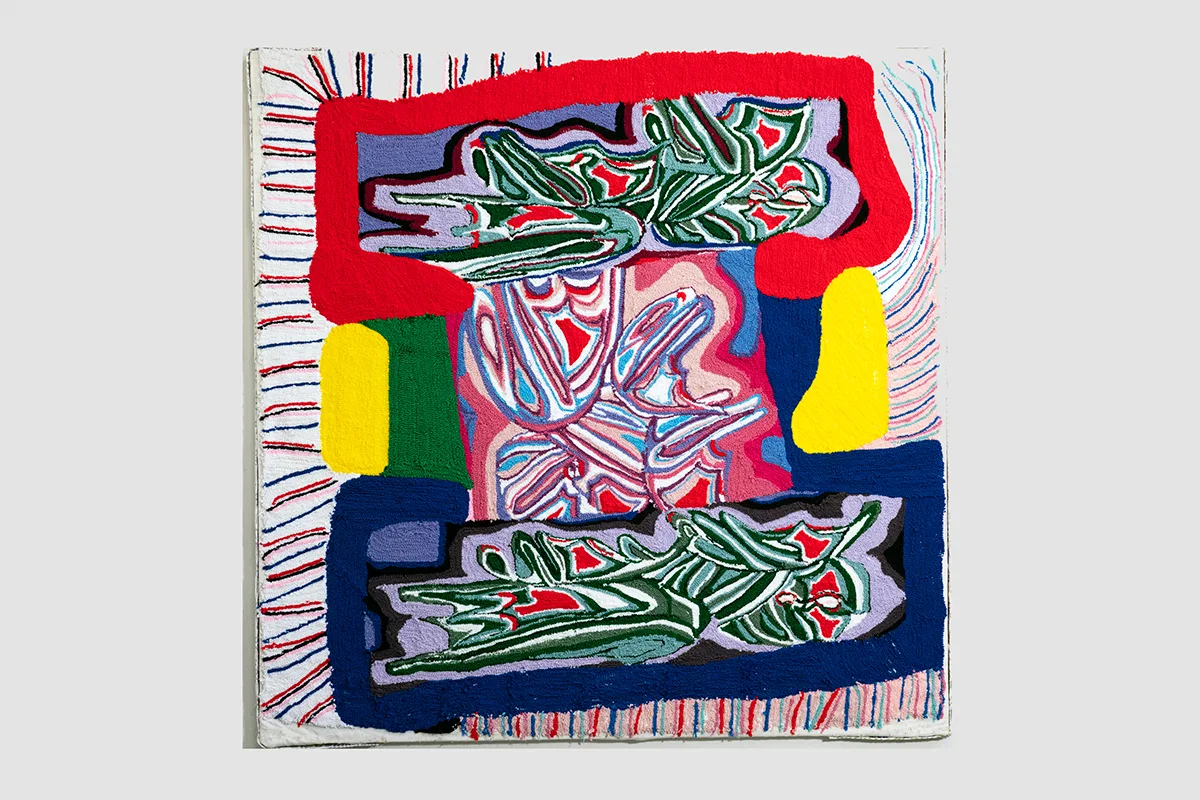 A large-scale painting made entirely of brightly-colored yarn that feature abstraction. It depicts a digital doodling