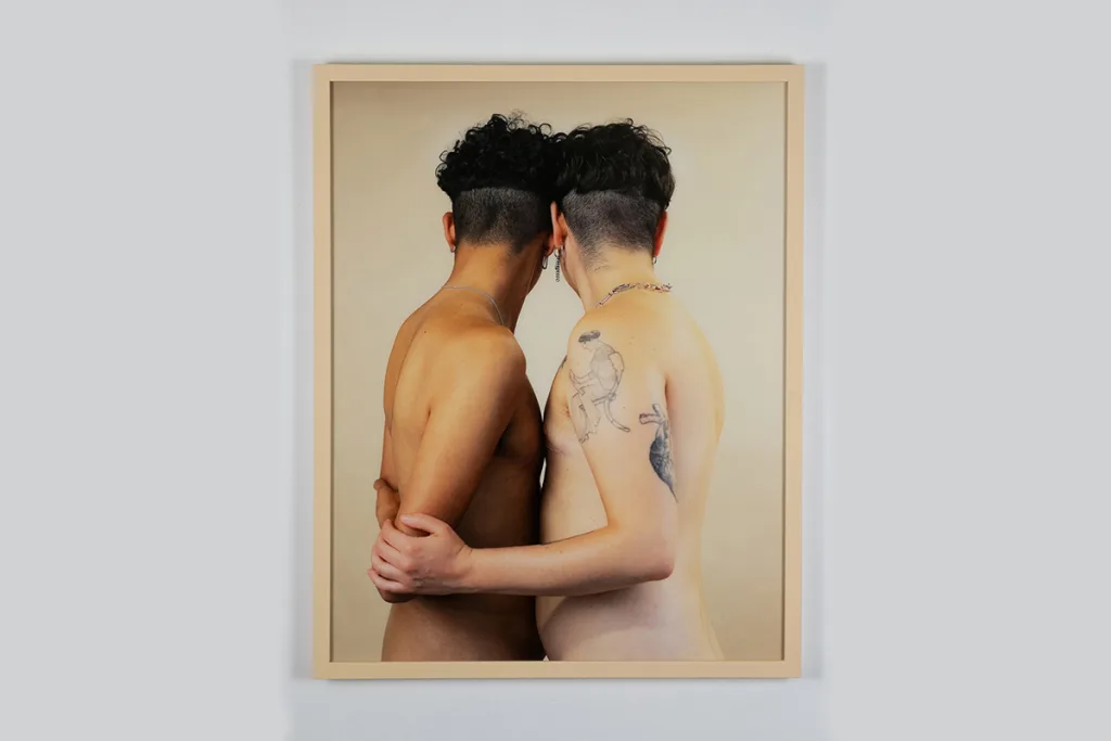 A photo of two human figures who are holding each other firmly