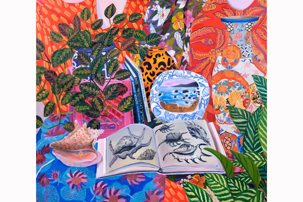 A painting by artist Anna Valdez of still life on a table with colorful tablecloth patterns. A book of seashells sit next to a conch seashell, an image of the ocean in a frame, milk crates, books, vases with detailed patterns and colorful drapes in the background.