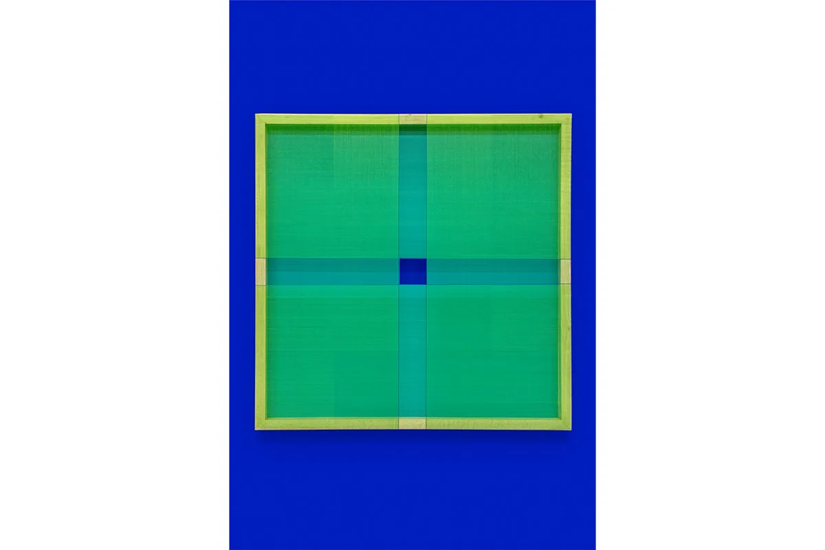 A hanging-wall sculpture by artist Brian Wills using multi-colored, Single strand poly layered with acrylic and YKB