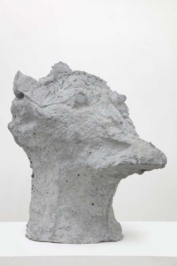 sculpture head with grooves and coarse textures