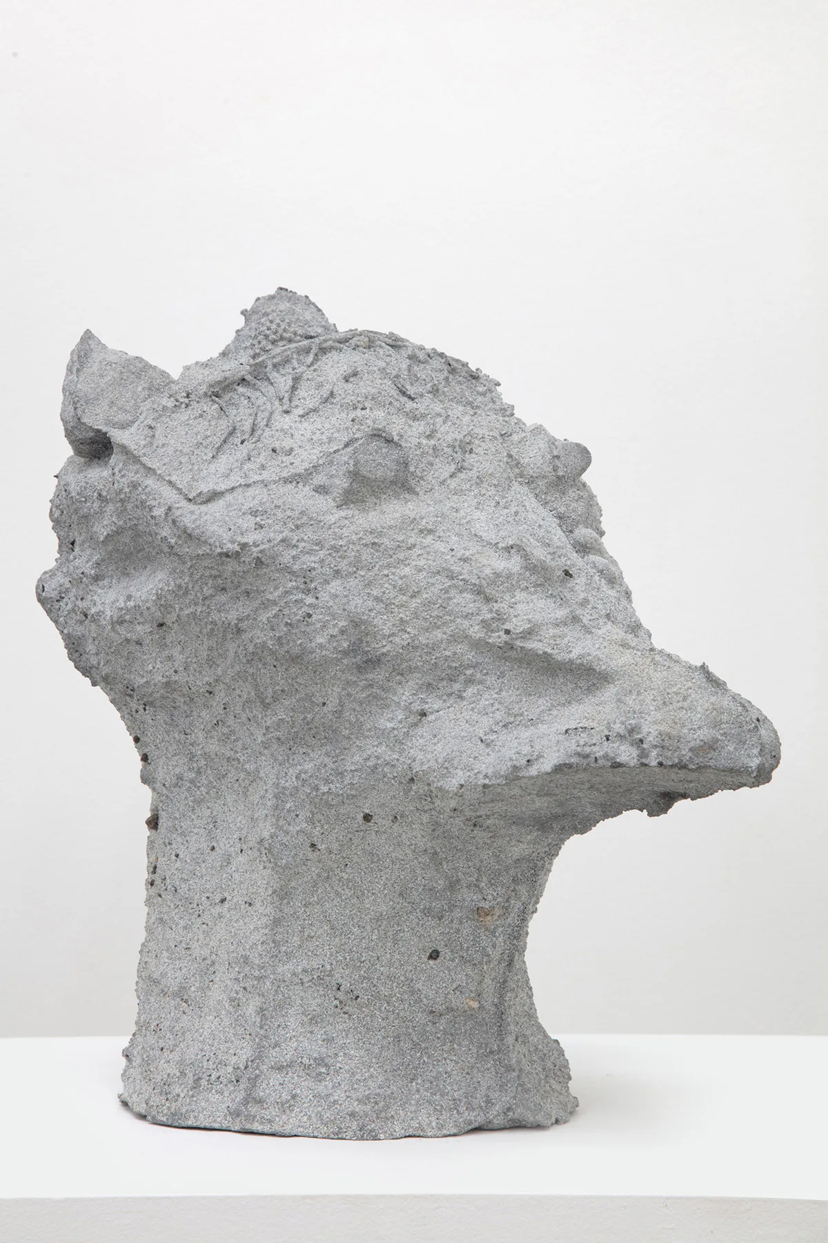 sculpture head with grooves and coarse textures