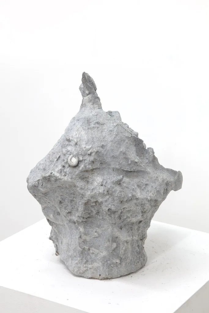 sculpture head with grooves and coarse textures