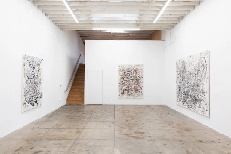 Gallery view of "Glyph" centered, and "War" to the left with "Machine" to the right