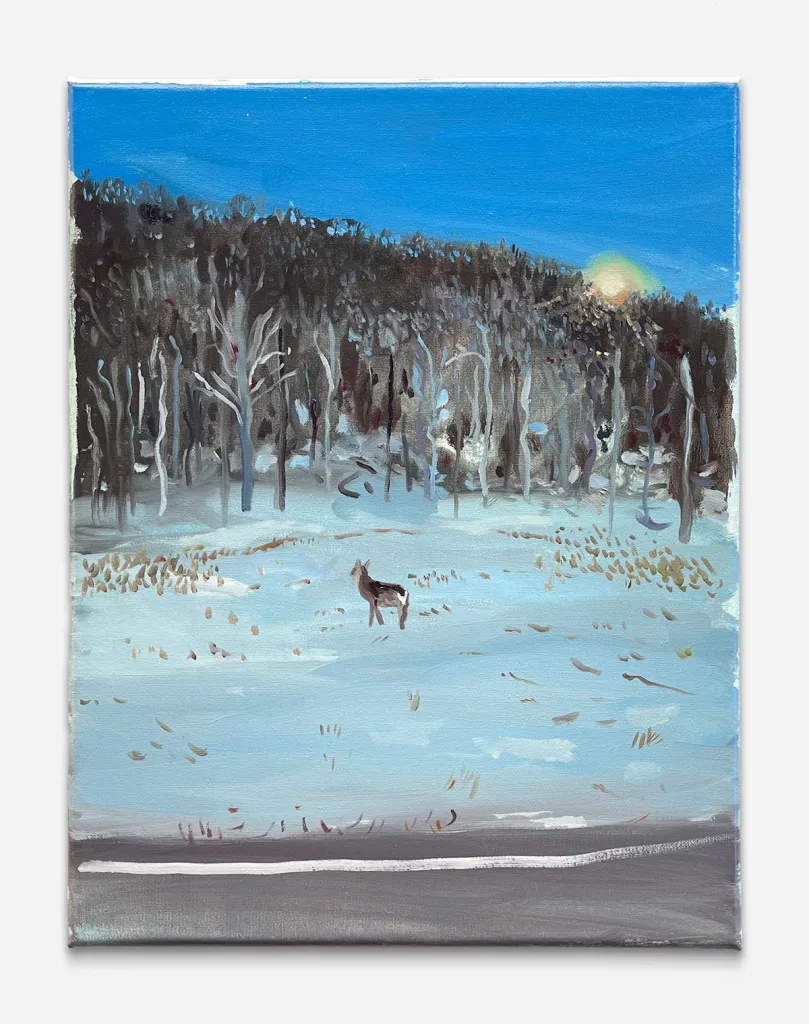a lone doe in the white snow looking towards tall brown trees that meet the setting sun and blue sky