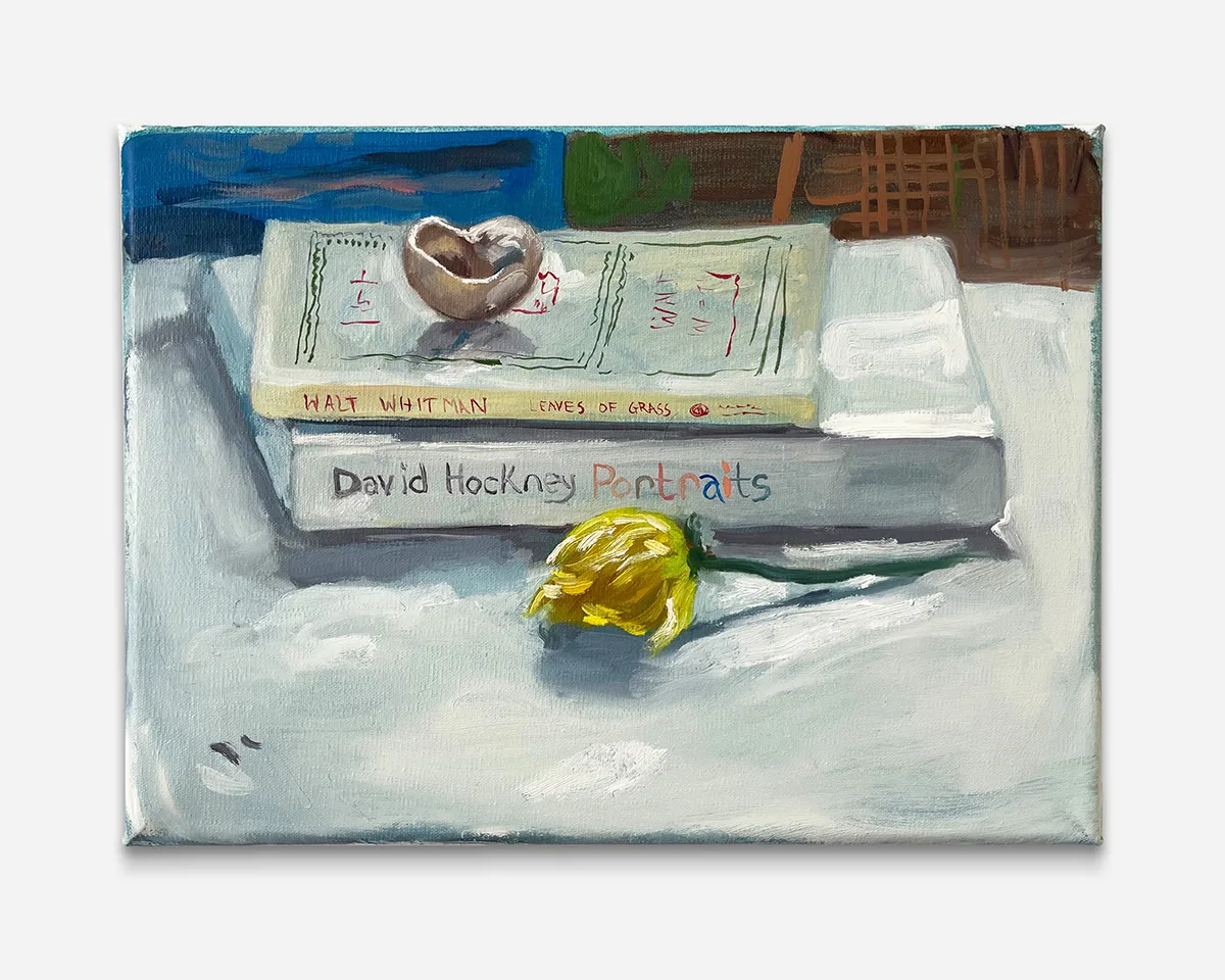 a painting of two books with a wilted yellow flower in front and an open shell on top
