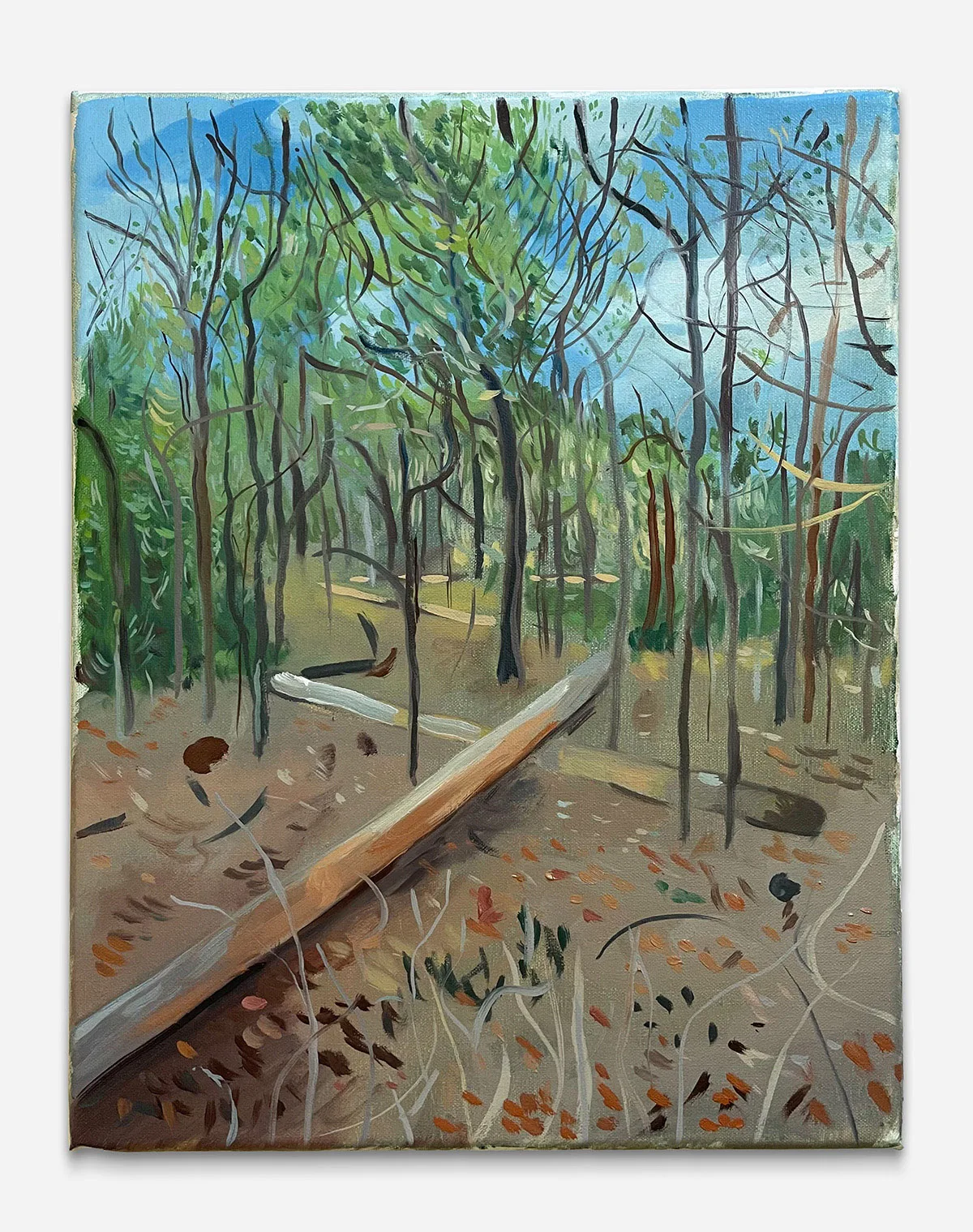 an image of painted trees with a blue sky and two fallen logs on the ground