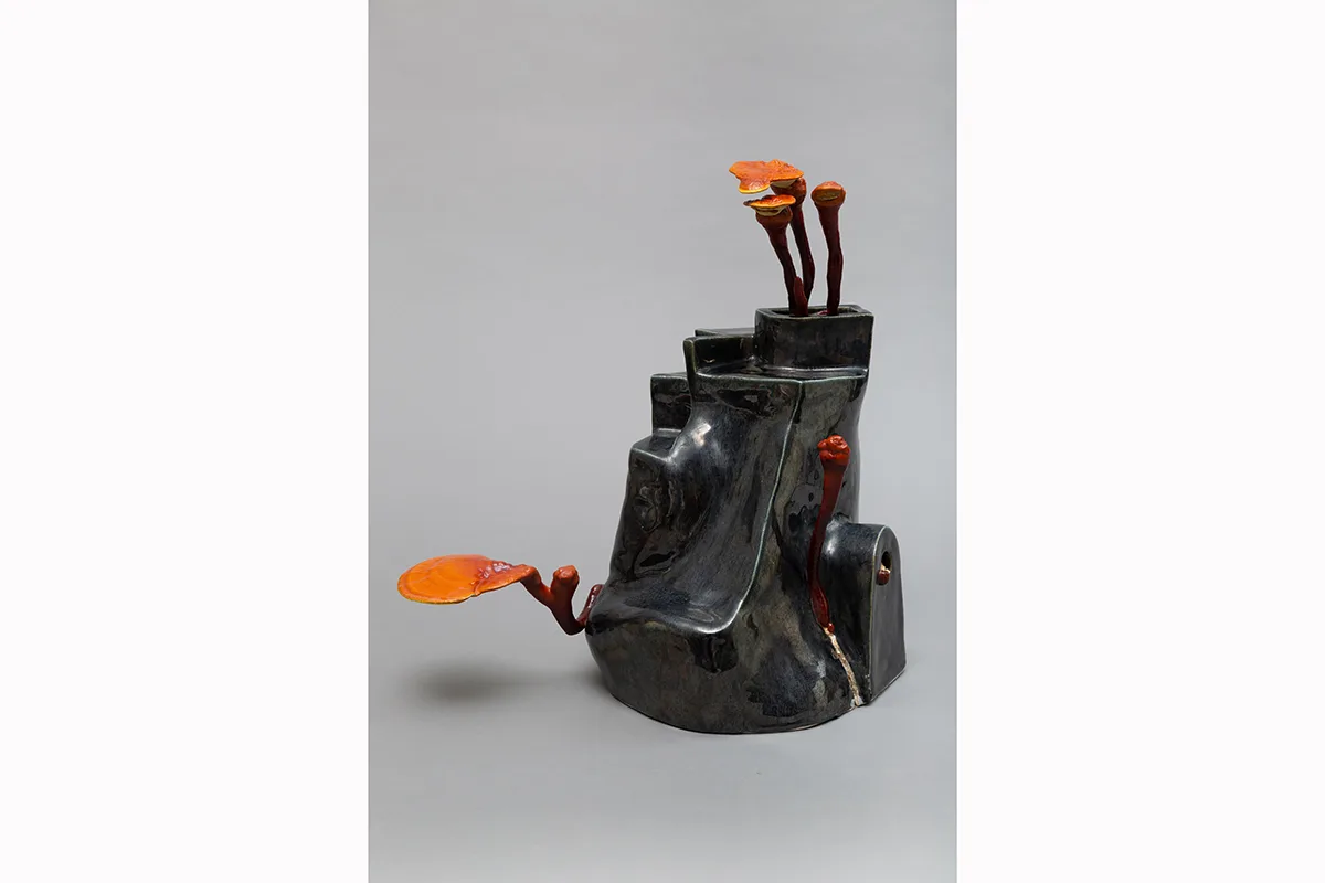 Image of a Sam Shoemaker piece featuring mushrooms sprouting out of a ceramic vessel