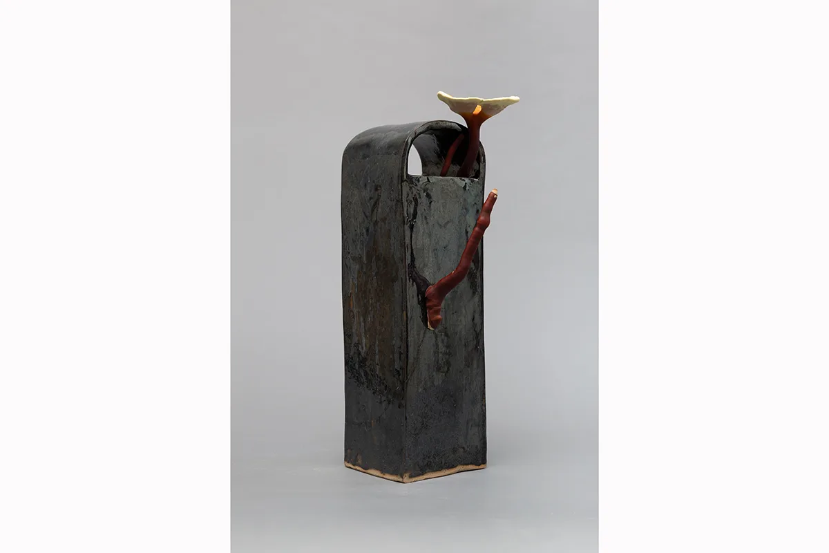 Image of a Sam Shoemaker piece featuring mushrooms sprouting out of a ceramic vessel
