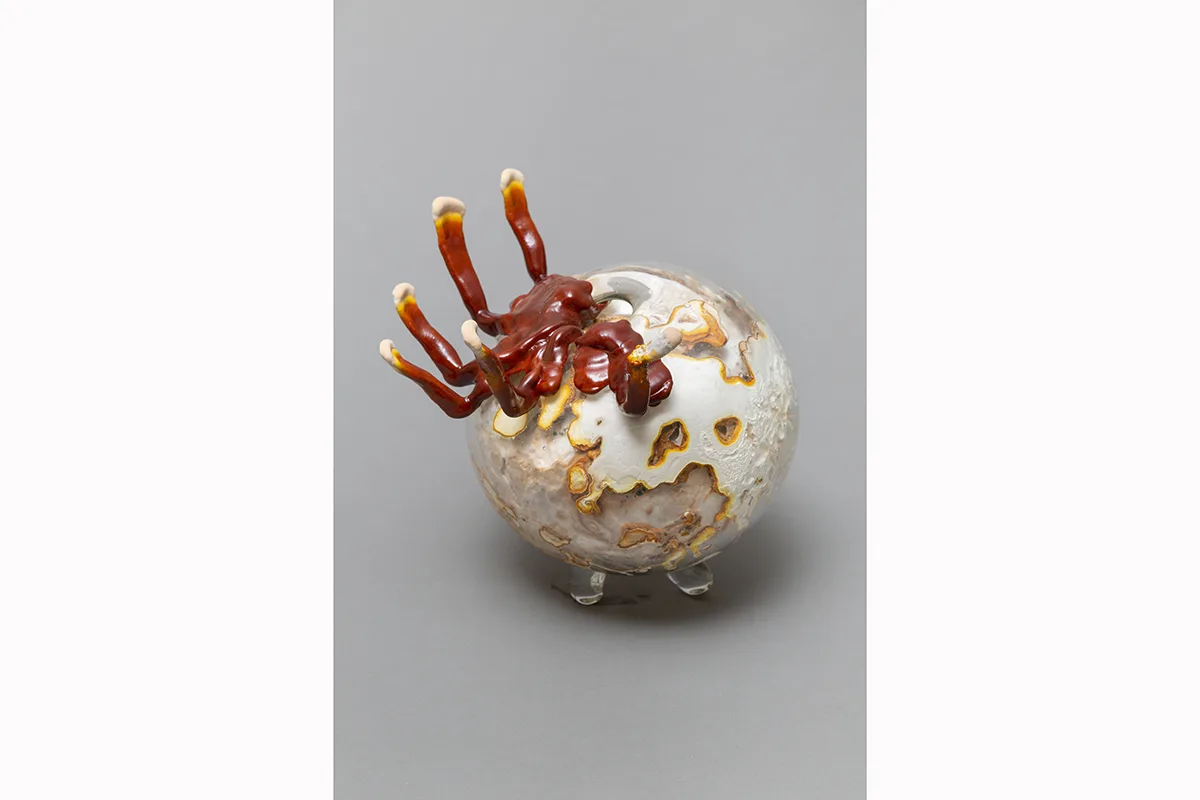 Image of a Sam Shoemaker piece featuring mushrooms sprouting out of a ceramic vessel