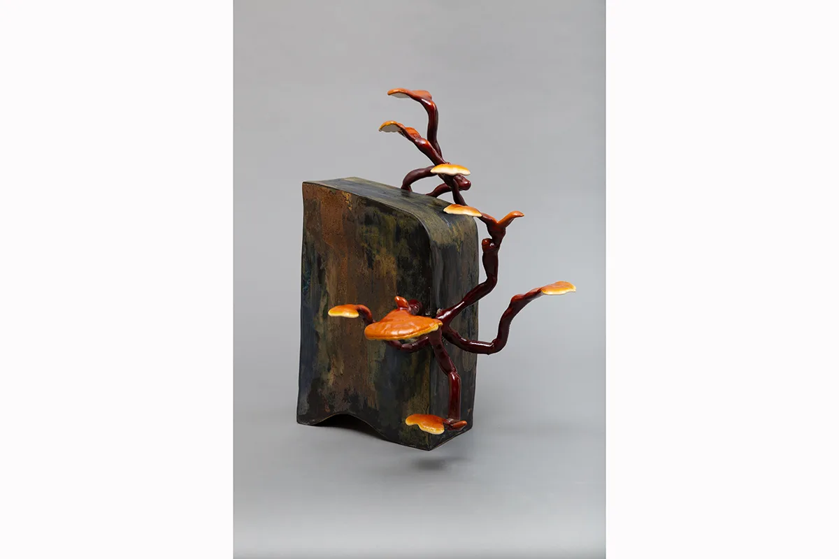 Image of a Sam Shoemaker piece featuring mushrooms sprouting out of a ceramic vessel