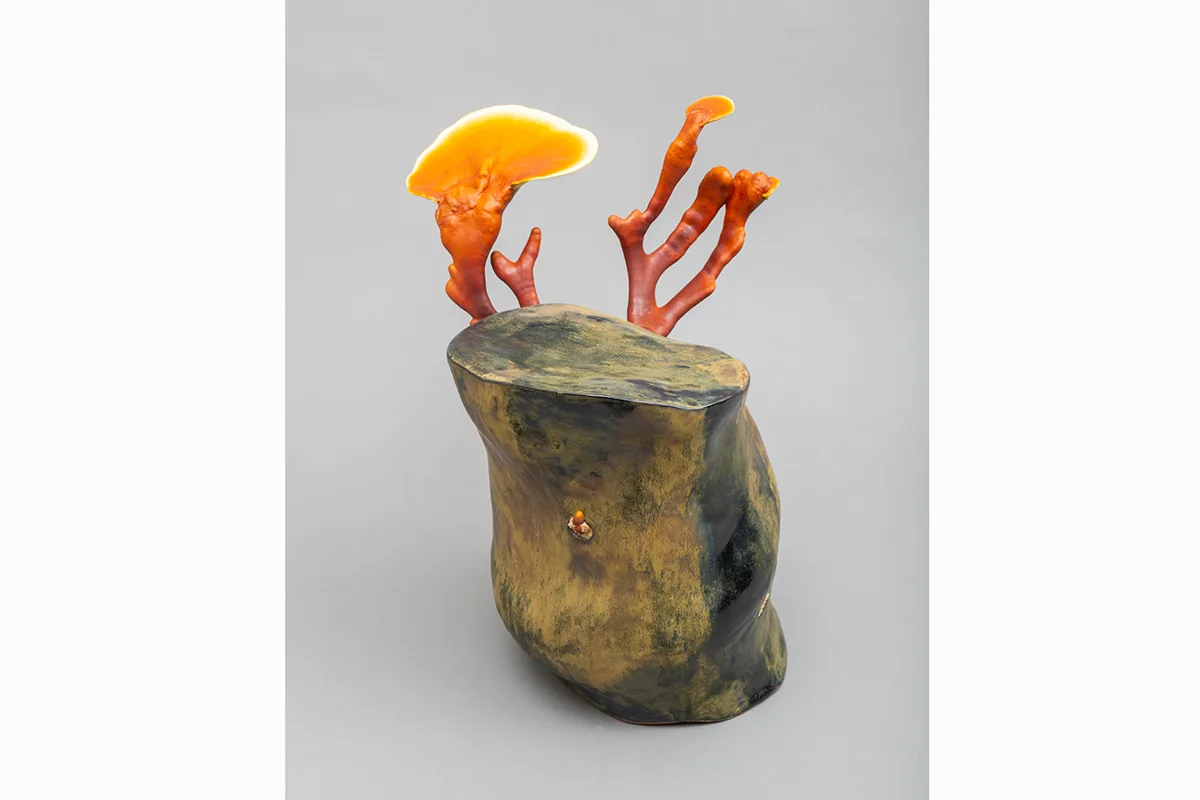 Image of a Sam Shoemaker piece featuring mushrooms sprouting out of a ceramic vessel