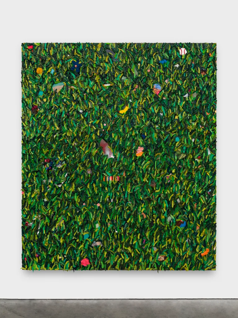 Layers of paint in various shades of green are applied to create a three-dimensional affect.
