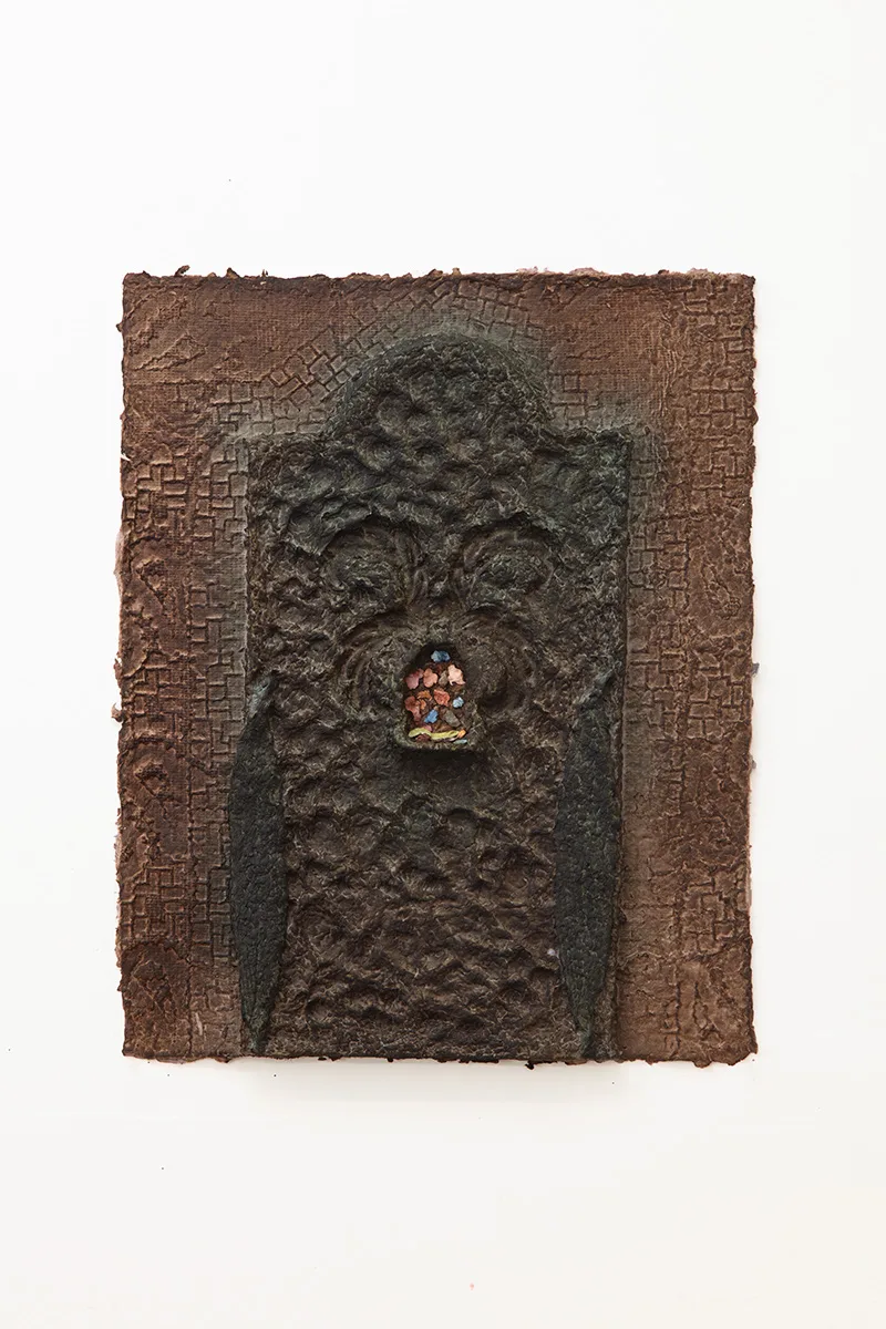 Green handmade dyed paper with an obscured figure/archway at the center