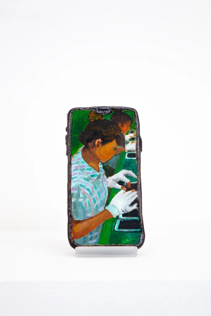 Image of Young Joo Lee’s Unknown Worker #7, a glazed ceramic iPhone with a portrait painted on its surface.