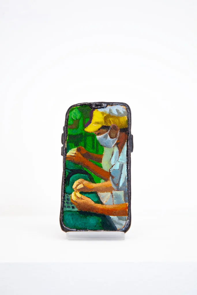 Image of Young Joo Lee’s Unknown Worker #8, a glazed ceramic iPhone with a portrait painted on its surface.