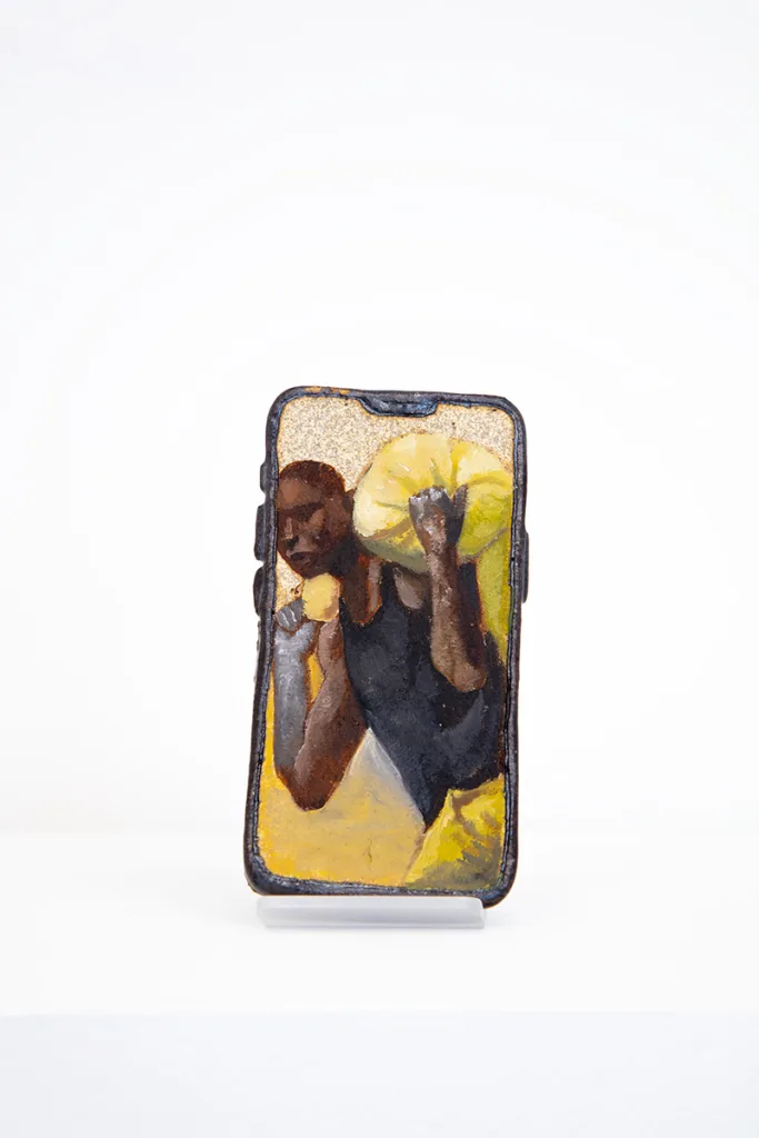 Image of Young Joo Lee’s Unknown Worker #10, a glazed ceramic iPhone with a portrait painted on its surface.