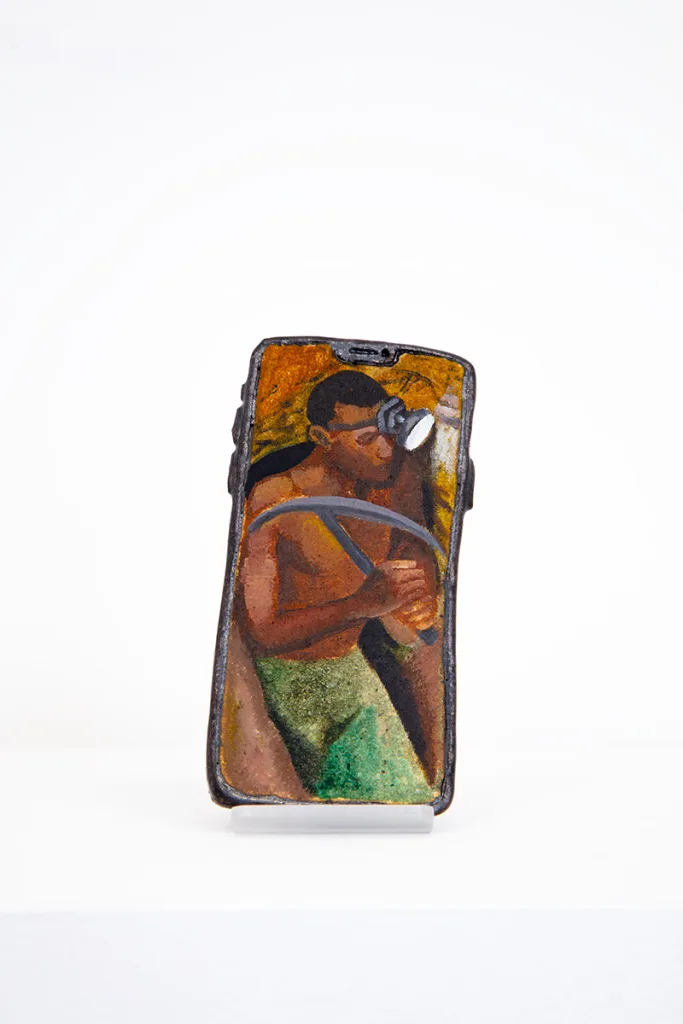 Image of Young Joo Lee’s Unknown Worker #11, a glazed ceramic iPhone with a portrait painted on its surface.