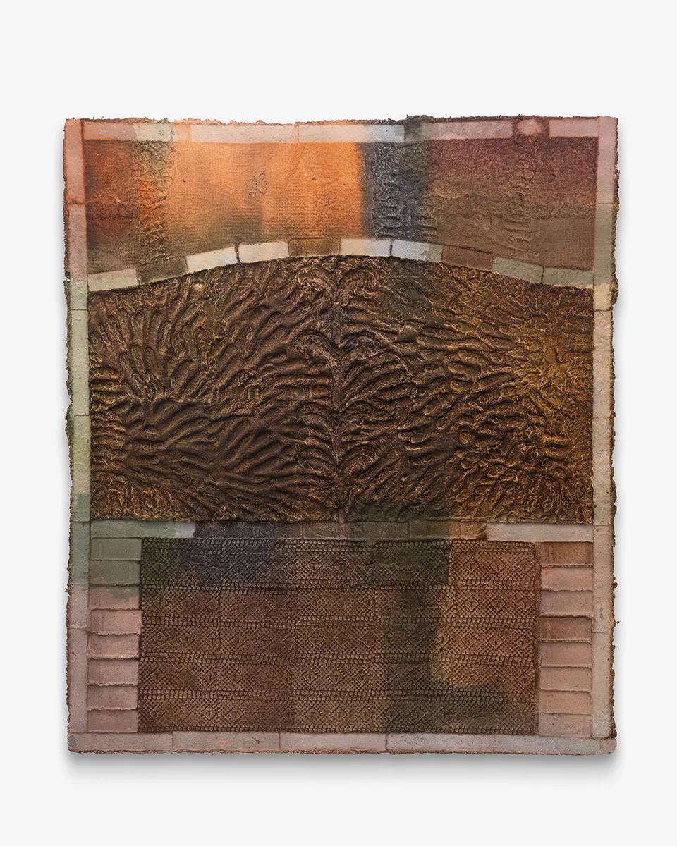 A collection of finger and brick impressions on earth toned handmade dyed paper