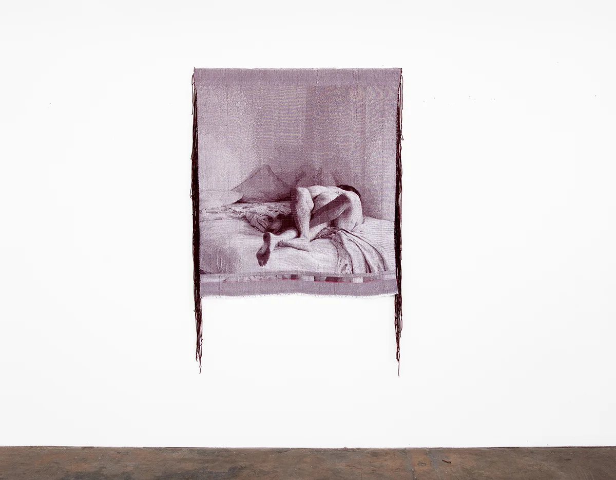 Another purple woven tapestry depicting two figures on a bed