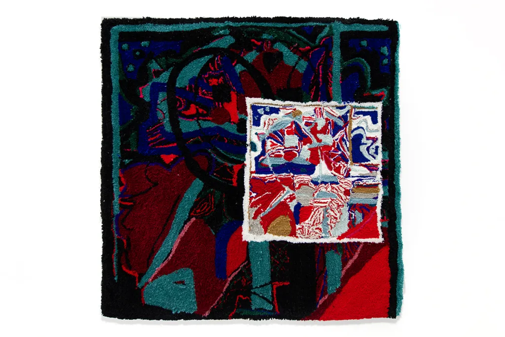 A tufted image of various blue, red, black, white, and aqua shapes arranged atop eachother.