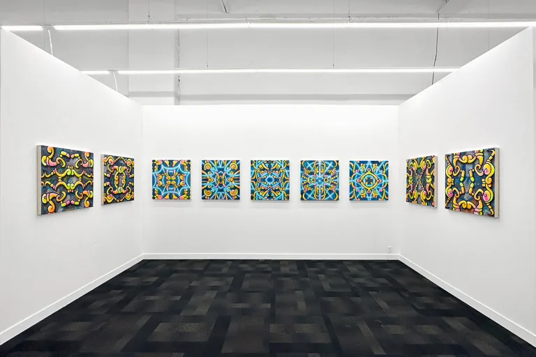 art fair booth featuring works by ozzie juarez