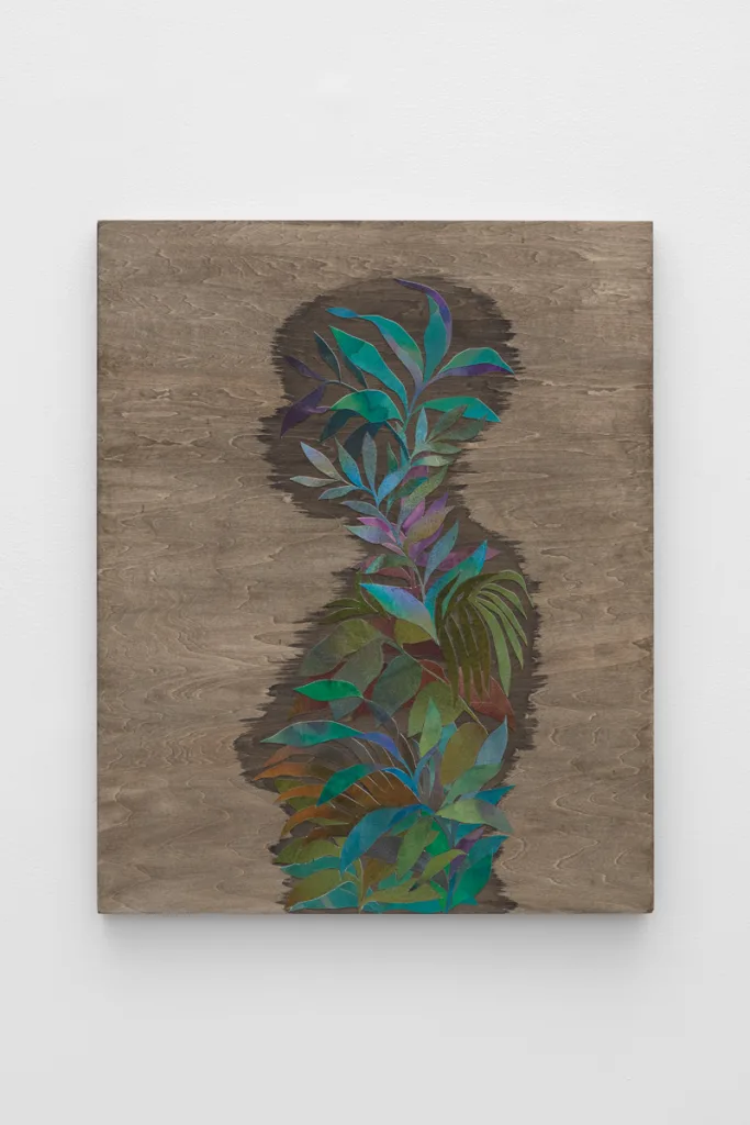 Ink on cut paper and wood stain arranged to form the profile of a figure on a panel. The paper is cut in a way that resembles foliage and the wood stain outlines the shape of the figure.