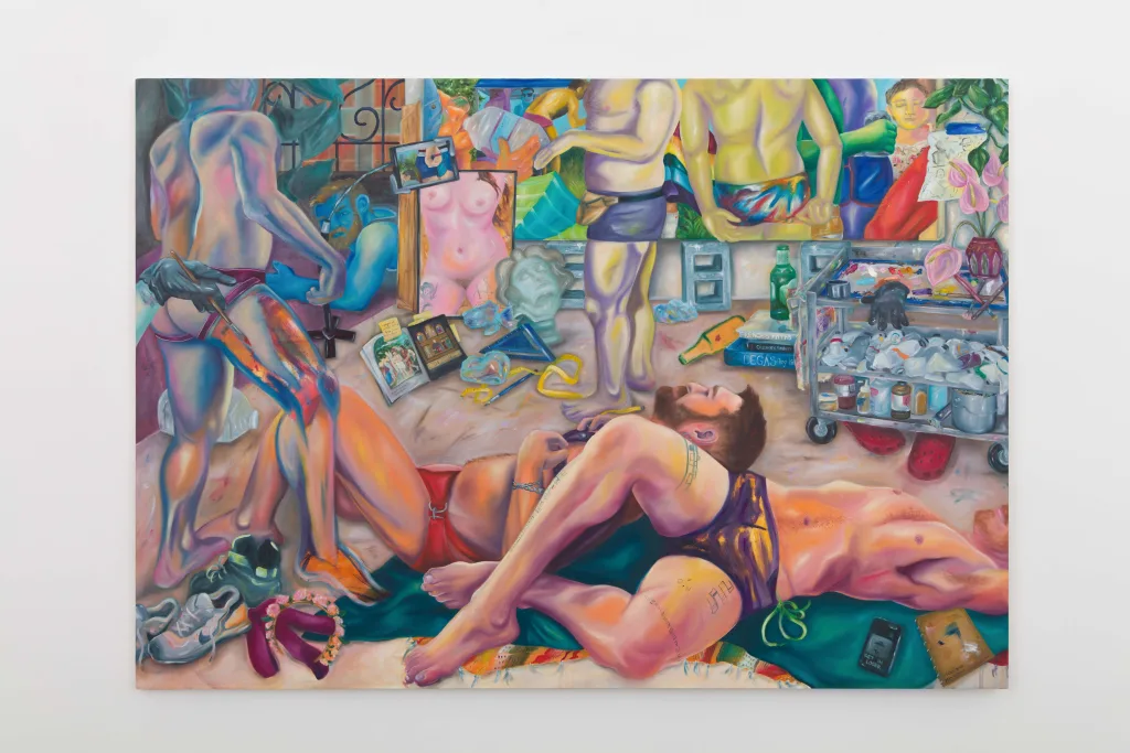 A painting depicts a room with a man and woman. Two figures lie on the floor, one being painted on, while another paints a large canvas. There are painting materials on the floor even sneakers and a crocs.